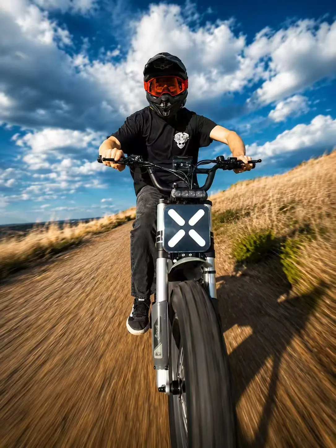 Forever BLU rider moving through open South African terrain